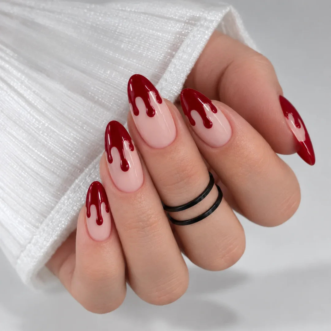 Blood drip French nails on a sheer nude base